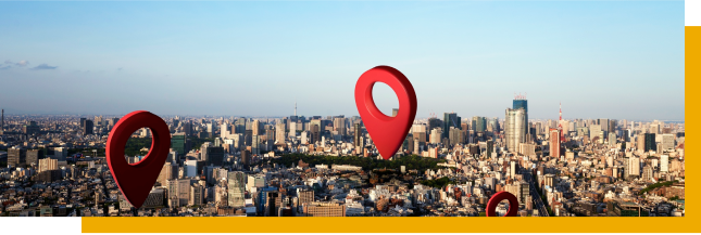 A person using Google Maps on a phone to locate their business, with a map and location pin visible on the screen