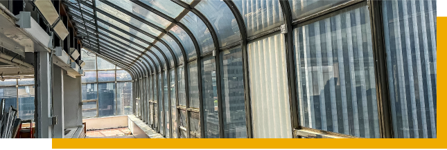 A large glass window showcasing a panoramic view of the city skyline